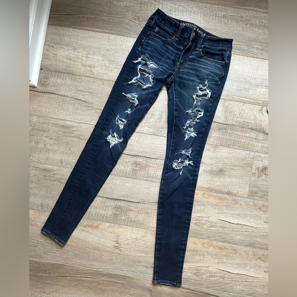 American Eagle Distressed dark wash jegging jean. Size 2 xlong. Like new!